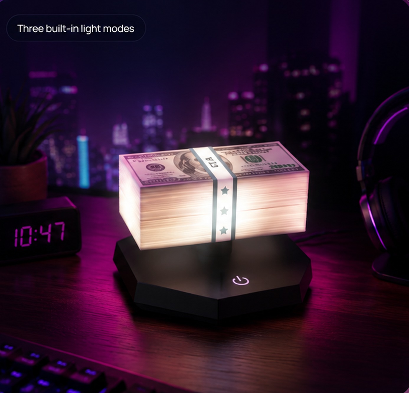 Glow District rotating LED money stack lamp glowing on a dark desk